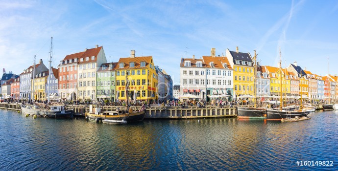 Picture of Nyhavn with its picturesque harbor and colorful facades of old houses in Copenhagen Denmark
